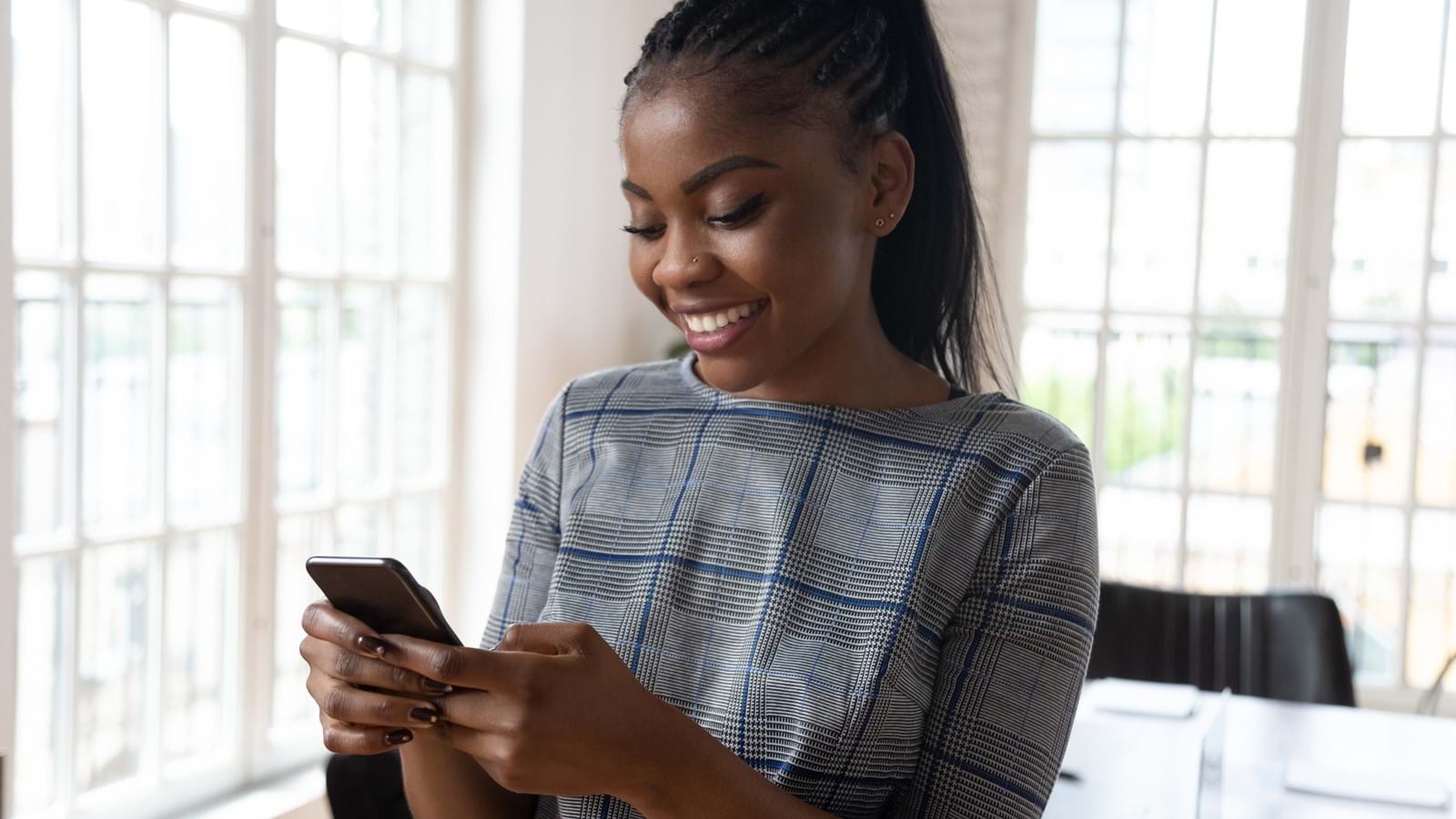 Woman looking at Unily's new follow features on mobile