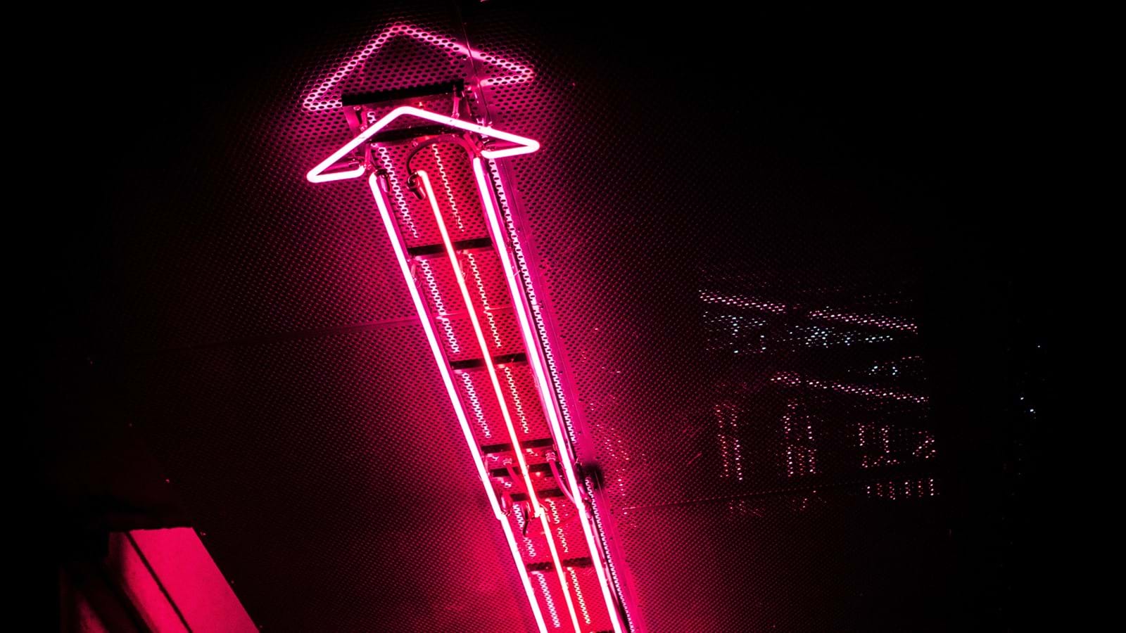 Pink arrow light representing the role of email in internal communications