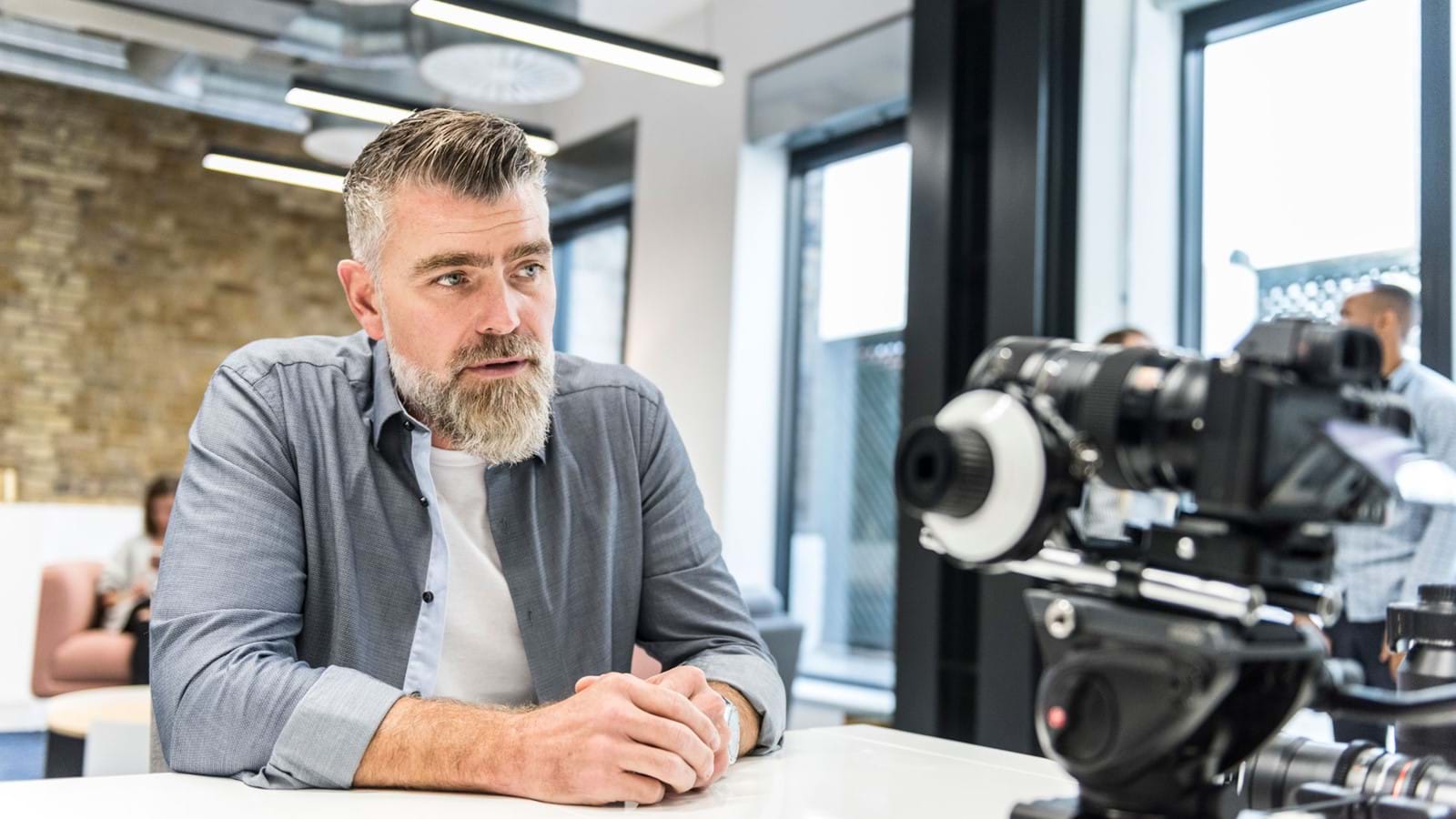 Employee filming himself as part of digital transformation strategy