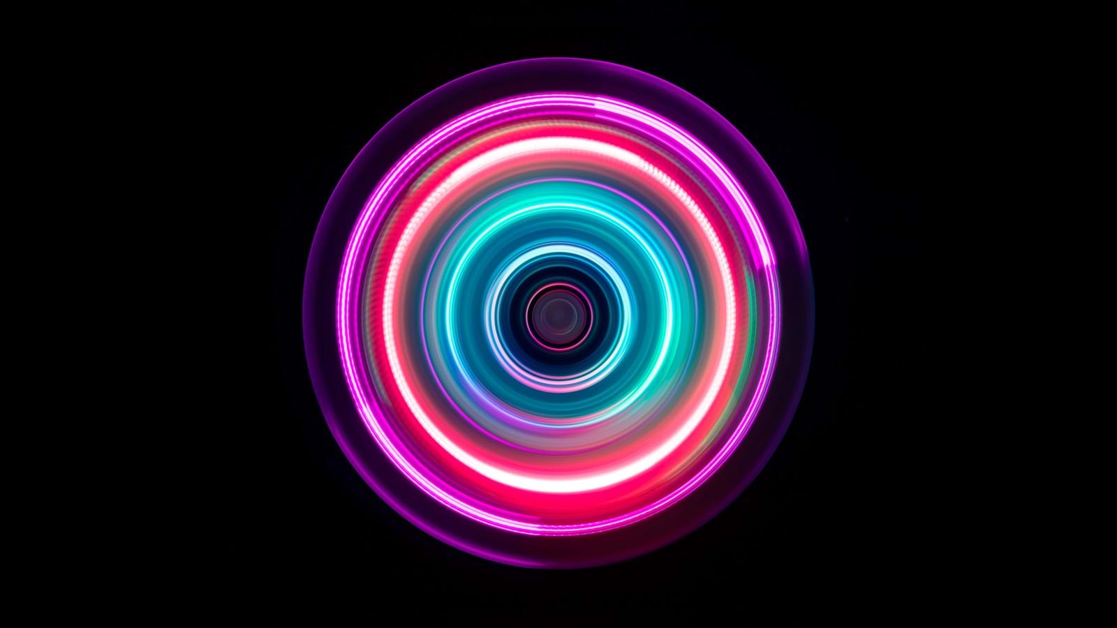 Colorful light swirl symbolizing a united tech stack