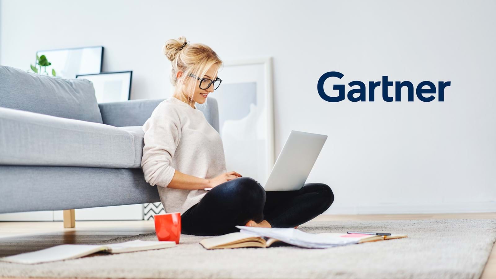 Employee reading Gartner’s Market Guide on her laptop