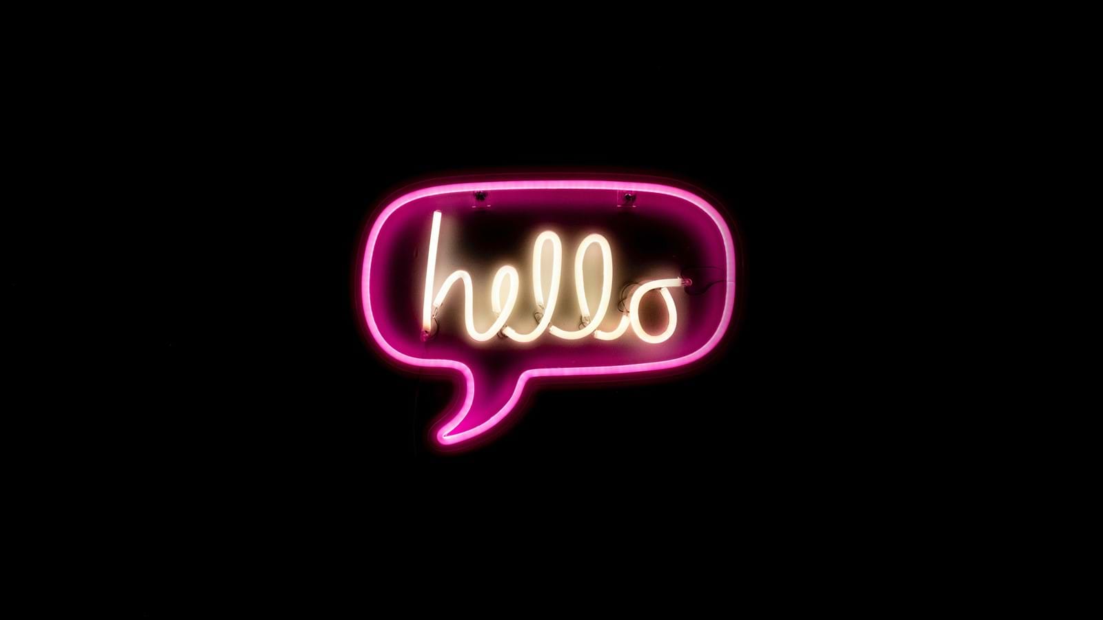 Neon 'hello' sign symbolizing internal communications