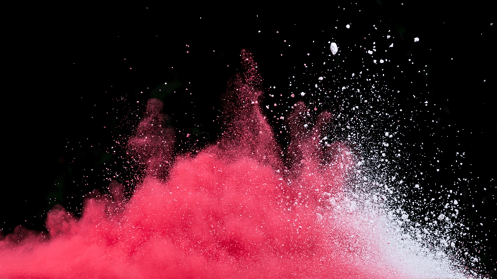 Red and white powder being thrown up into the air representing changing the enterprise