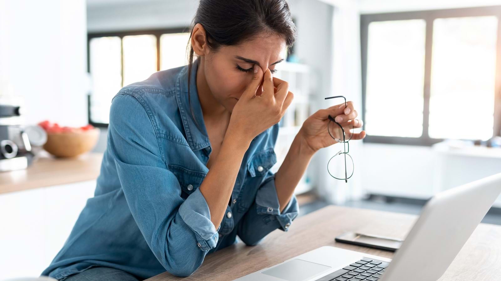 Stressed remote worker feeling the effects of bad employee experience